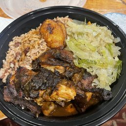 Jerk chicken, rice and cabbage. Jerk chicken, rice and cabbage.