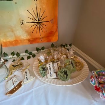 One Apron Bakery - a table with cookies and candy - Desserts Near Me