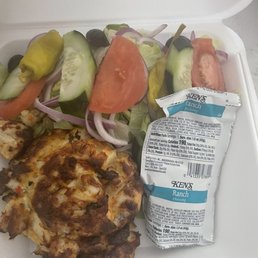 Crabcake with salad. Crabcake with salad.