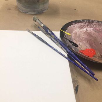 The Lost Canvas - a bowl of paint and two paintbrushes on a table - Art Supplies Near Me - Keokuk, Iowa