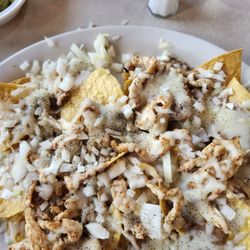 El Ranchito - Chicken nachos. Find chicken! I dare you! Ask for easy onions you get onion nachos.