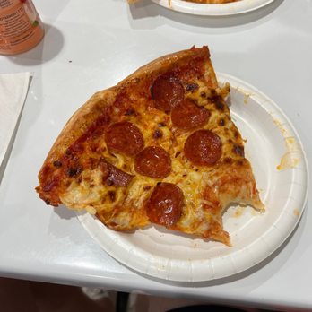 Costco - two slices of pepperoni pizza on paper plates - Wholesale Stores Near Me - Leesburg, Virginia