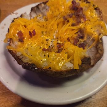 Texas Roadhouse - The potato was nice and crispy where it needed to be but barely any bacon on it 3 of 5 - Steakhouses Near Me - Harrisburg, Pennsylvania