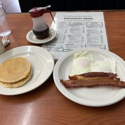 Kim & Jenny's Restaurant - Pancakes are minis. $10.49 including coffee.  Should be option for larger pancakes. These are like a senior meal.