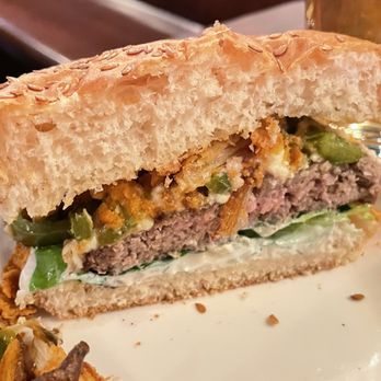 Bittercreek Alehouse - Spicy lamb burger cut in half - Bars Near Me - Boise, Idaho