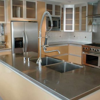 Henderson Bay Construction - a kitchen with stainless steel appliances - General Contractors Near Me