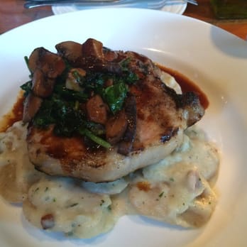 Queequeg's - Berkshire pork with smashed fingerling potatoes, bacon Lardon, wild mushrooms, and garlic spinach. - New American Near Me - Nantucket, Massachusetts