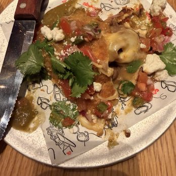Simmzy's - Half eaten chimichanga - Gastropubs Near Me - Long Beach, California Simmzy's - Half eaten chimichanga - Gastropubs Near Me - Long Beach, California