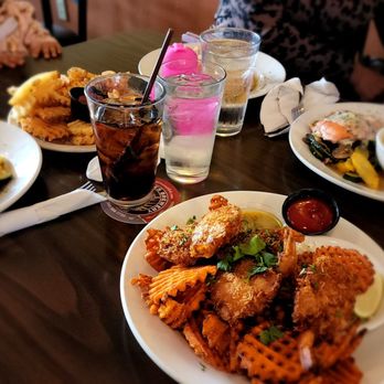 Rockfish Grill - a table full of food and drinks - Seafood Near Me - Anacortes, Washington