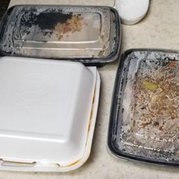 three trays of food left on the counter