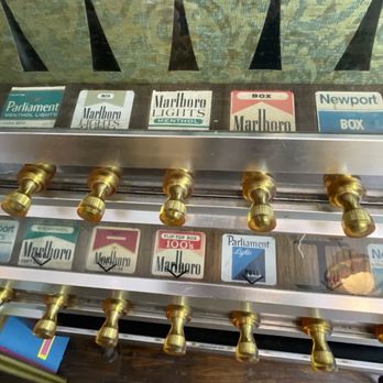 Casano’s Pizza Parlor - Ol' cigarette machine...brings back memories of childhood. That's how easy it was way back when to buy cigarettes, lol! - Pizza Near Me - Rutherford, New Jersey