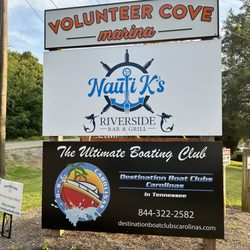 Nauti K's Riverside Bar & Grill - Advertisement at the entrance