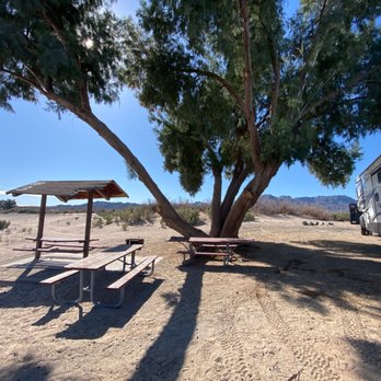 Pirate Cove Resort - Tables at campsite and some shade - RV Rental Near Me - Needles, California Pirate Cove Resort - Tables at campsite and some shade - RV Rental Near Me - Needles, California