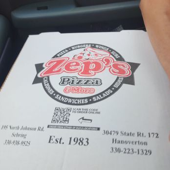 Zep's Pizza Shop - a hand holding a piece of pizza - Pizza Near Me - Sebring, Ohio Zep's Pizza Shop - a hand holding a piece of pizza - Pizza Near Me - Sebring, Ohio