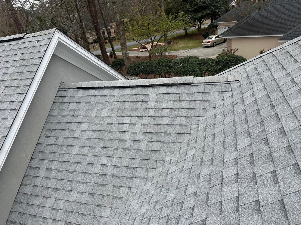 Slide of Palma's Roofing Experts