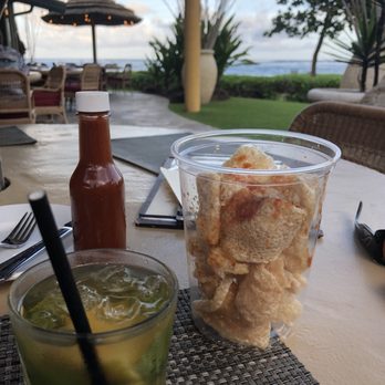 Oasis on the Beach - Just add hot sauce and shake! Can't go wrong with fried pork skins. That's also the special whiskey cocktail. - Hawaiian Near Me - Kapaa, Hawaii Oasis on the Beach - Just add hot sauce and shake! Can't go wrong with fried pork skins. That's also the special whiskey cocktail. - Hawaiian Near Me - Kapaa, Hawaii