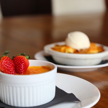 Captains Table - two bowls of dessert with strawberries and ice cream - Seafood Near Me - Ocean City, Maryland