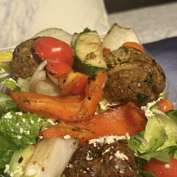 Fuego Mediterranean Grill - Salad with the fried chickpea cake. - Mediterranean Near Me - Escondido, California Fuego Mediterranean Grill - Salad with the fried chickpea cake. - Mediterranean Near Me - Escondido, California