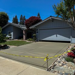 Premier Concrete Creations - Broom Finished Concrete Driveway with a border.