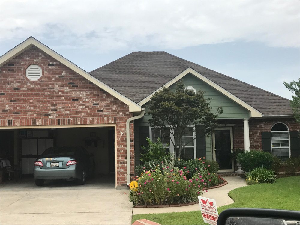 Slide of John Theriots Roofing
