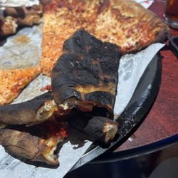 JT's Sports Bar & Grill - Burnt pizza