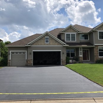 Sealcoat Solutions - a house with a driveway in front of it - General Contractors Near Me - Andover, Minnesota Sealcoat Solutions - a house with a driveway in front of it - General Contractors Near Me - Andover, Minnesota