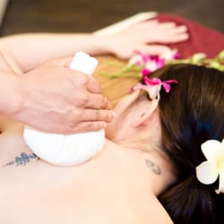 Hot Herbal Compress Massage. Herbs are wrapped in the muslin cloth and applied gently onto your body to stimulate circulation.