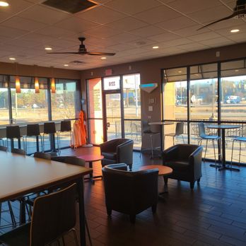 Dunkin' - a view of a dining area with chairs and tables - Donuts Near Me - Florence, South Carolina Dunkin' - a view of a dining area with chairs and tables - Donuts Near Me - Florence, South Carolina