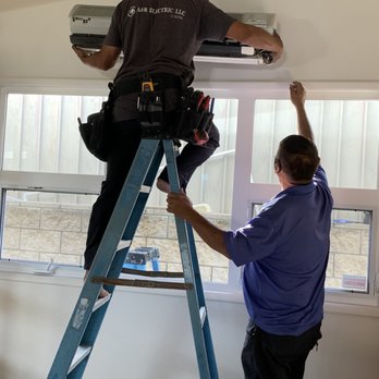 A&R Electric - Owner Mel & Lonnie removing old a/c - Electricians Near Me A&R Electric - Owner Mel & Lonnie removing old a/c - Electricians Near Me