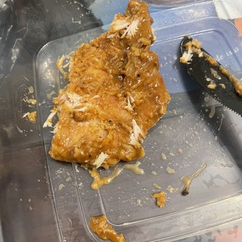 Kisha’s Kitchen - 1/2 eaten Smothered Porkchops with Rice - Soul Food Near Me - Chicago, Illinois