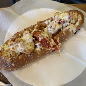 Abruzzo's Pizza - a piece of bread with cheese on it - Pizza Near Me - Jacksonville, North Carolina Abruzzo's Pizza - a piece of bread with cheese on it - Pizza Near Me - Jacksonville, North Carolina