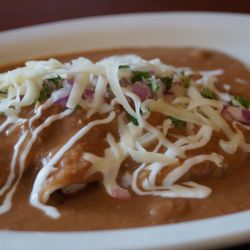 Breakfast - Enfrijoladas Corn tortillas filled with your choices of chicken or cauliflower topped with creamy and lightly spicy bean sauce