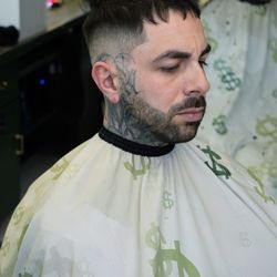 The art of kevins Barbershop - Haircut and beard trim with a modern fade and sharp, clean lines. Professional barber shop grooming service focused on detail, modern style.