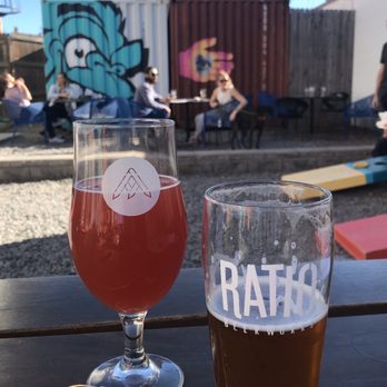 Ratio Beerworks - Dog friendly Outdoor space with communal Wooden Bench Tables and Corn hole games. - Breweries Near Me - Denver, Colorado