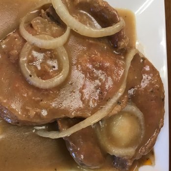 Oley's Kitchen & BBQ - Smothered pork chops. - Soul Food Near Me - Orlando, Florida Oley's Kitchen & BBQ - Smothered pork chops. - Soul Food Near Me - Orlando, Florida