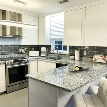 Modern Touch - a kitchen with granite counter tops - Cabinetry Near Me Modern Touch - a kitchen with granite counter tops - Cabinetry Near Me