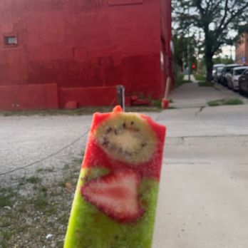 Palacana - a hand holding a piece of fruit on a stick - Ice Cream & Frozen Yogurt Near Me - Kansas City, Kansas Palacana - a hand holding a piece of fruit on a stick - Ice Cream & Frozen Yogurt Near Me - Kansas City, Kansas