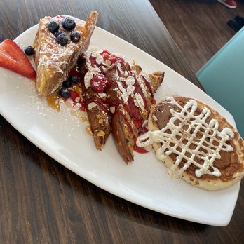 Broken Yolk Cafe - Sweet Trio (from left to right) Tiki Toast, Crunchy French Toast, and Cinna Cake - Breakfast & Brunch Near Me - Fullerton, California Broken Yolk Cafe - Sweet Trio (from left to right) Tiki Toast, Crunchy French Toast, and Cinna Cake - Breakfast & Brunch Near Me - Fullerton, California