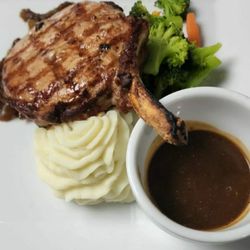 Village Saloon - Dinner porkchop gravy and whipped pototaoes delish!