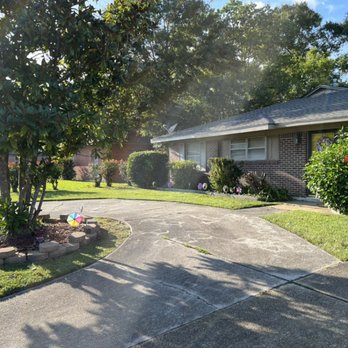 The Lawn Whisperer - a driveway in front of a house - Lawn Services Near Me The Lawn Whisperer - a driveway in front of a house - Lawn Services Near Me