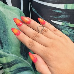 Four seasons Nail Spa - And what i got. UV Gel Extensions with gel polish and air brushed ombre sunset design. plus a cat eye. I'm obsessed! they're perfect!