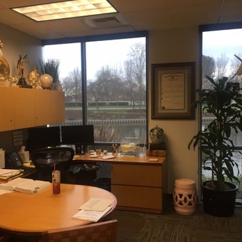 Haggerty Construction - an office with a desk and a large window - General Contractors Near Me - Stockton, California
