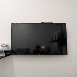 The technician mounted the TV on the wall The technician mounted the TV on the wall