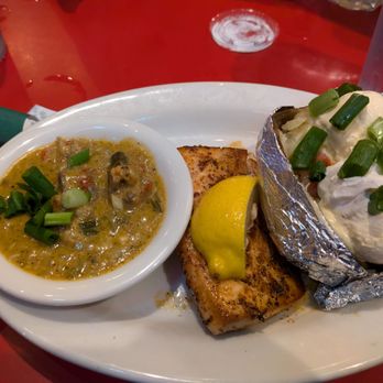 Wintzell's Oyster House - The grilled blackened fish with a loaded baked potato. Some sort of a seafood etouffee next to it (I think that's what an etouffee is) - Seafood Near Me - Mobile, Alabama