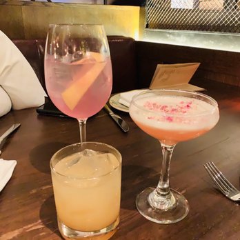 Gypsy Kitchen - 50 Shades of Purple (tall drink), The Seville Rose (pretty drink with rose on top) last one is a margarita (yellow) - Spanish Near Me - Atlanta, Georgia Gypsy Kitchen - 50 Shades of Purple (tall drink), The Seville Rose (pretty drink with rose on top) last one is a margarita (yellow) - Spanish Near Me - Atlanta, Georgia