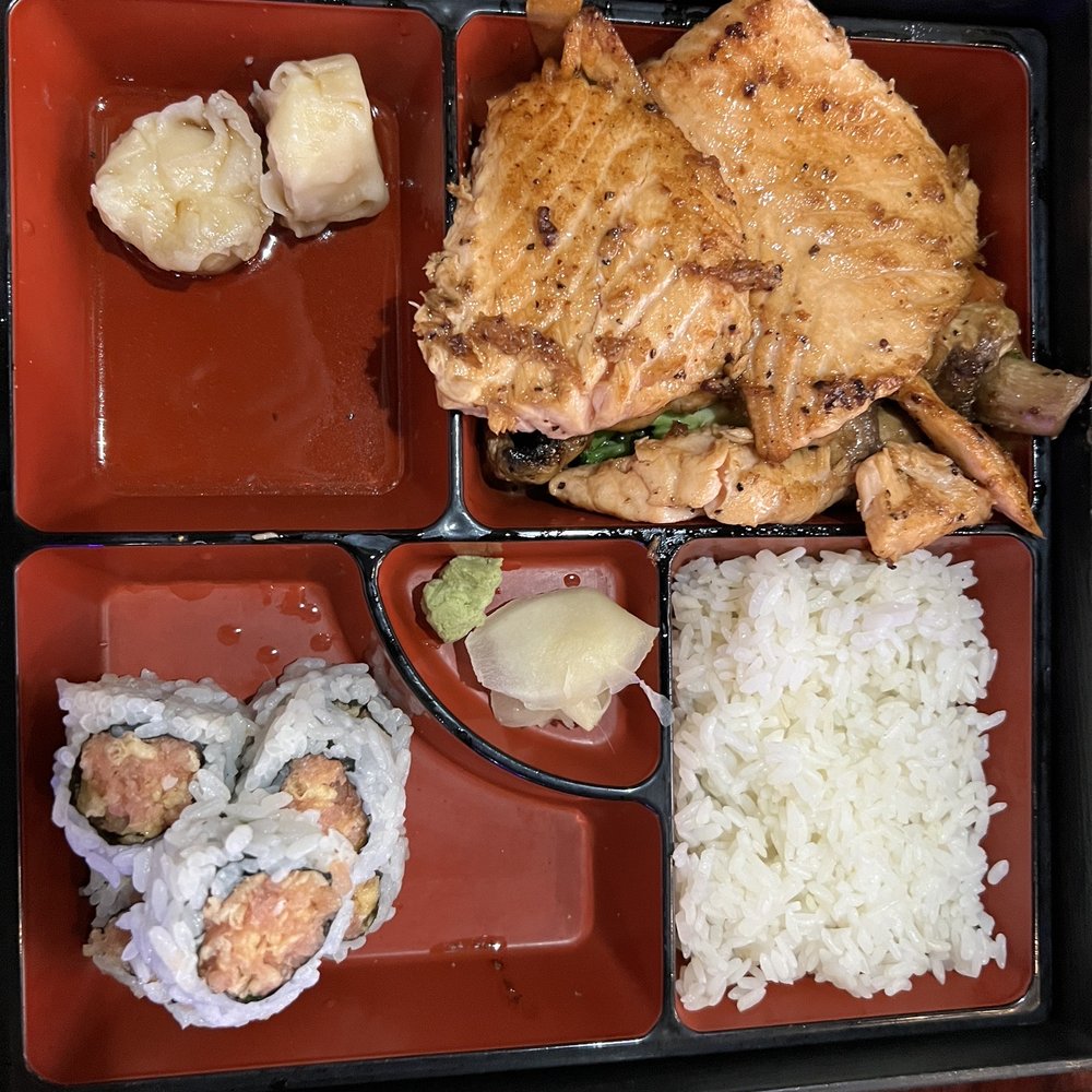 Hinode - Grilled salmon bento with spicy tuna roll, shumai, white rice and vegetables (underneath salmon) - Japanese Near Me - Oviedo, Florida Hinode - Grilled salmon bento with spicy tuna roll, shumai, white rice and vegetables (underneath salmon) - Japanese Near Me - Oviedo, Florida