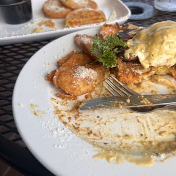 The Brunch Apothecary - Half eaten pork belly Benedict and potatoes Parmesan - Breakfast & Brunch Near Me - Dacula, Georgia