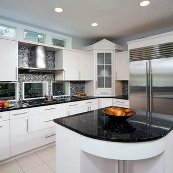 Ecobeco - a modern kitchen with white cabinets and black countertops - General Contractors Near Me - Laurel, Maryland Ecobeco - a modern kitchen with white cabinets and black countertops - General Contractors Near Me - Laurel, Maryland