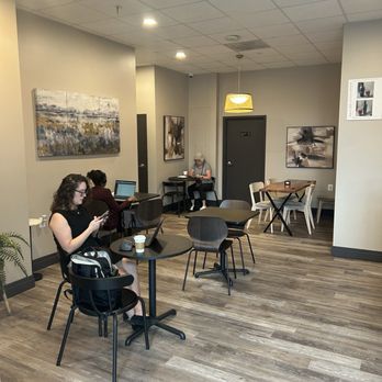 French Press - Main seating area with tables. They also have a few high tops near the window. - Coffee & Tea Near Me - Bethesda, Maryland
