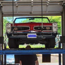 One Stop Automotive & Car Wash - 1966 Pontiac GTO on alignment rack at One Stop Automotive.
